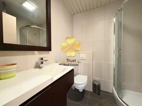 Small bathroom with a sink, toilet, and shower cabin. - image 19