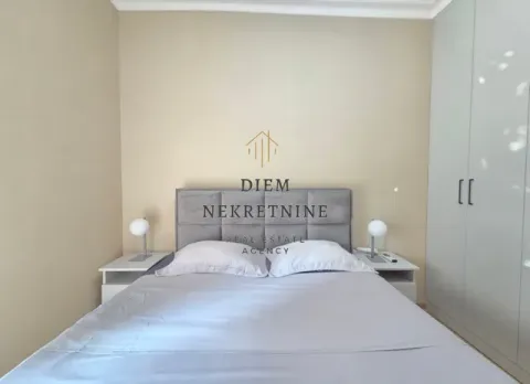 Furnished bedroom with a double bed, wardrobe, and nightstands. - image 8