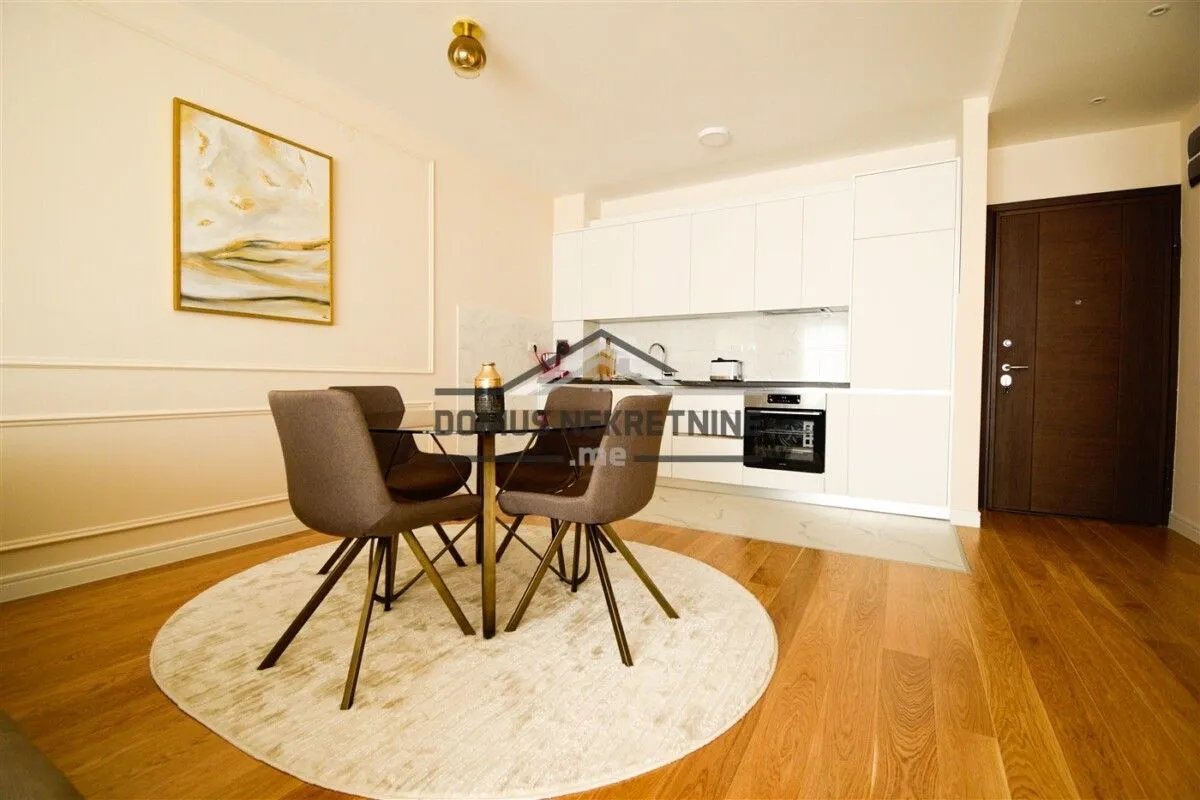 Modern kitchen with a dining area and built-in appliances.