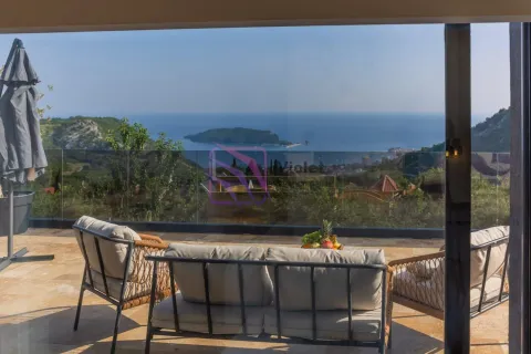 Furnished terrace with seating furniture and a sea view. - image 3