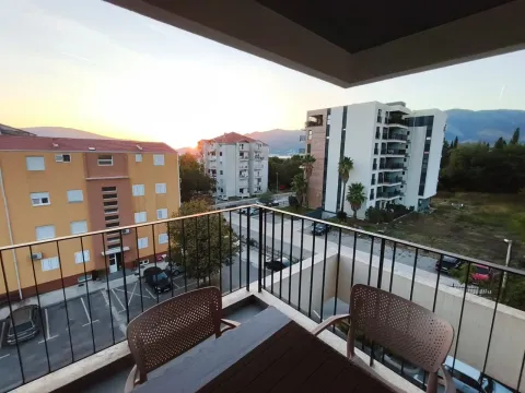View from the balcony overlooking surrounding buildings and the neighborhood during sunset. - image 9
