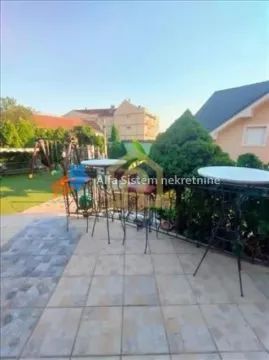 Spacious terrace with tables and chairs, overlooking the yard. - image 23