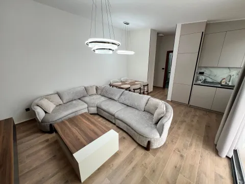 Living room with a sectional sofa and dining area in an open space layout. - image 5