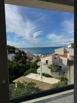 View of the sea and surrounding houses from the property terrace. - image 15