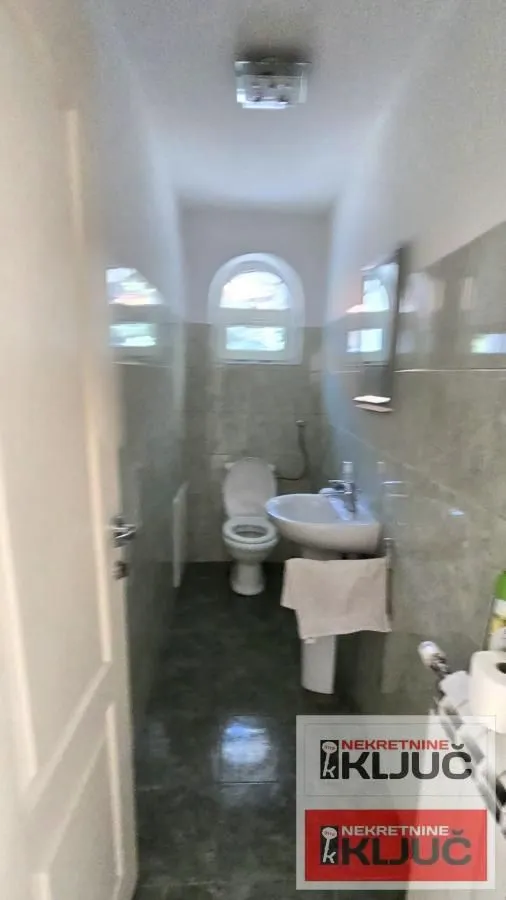Smaller bathroom with sanitary ware and a window.