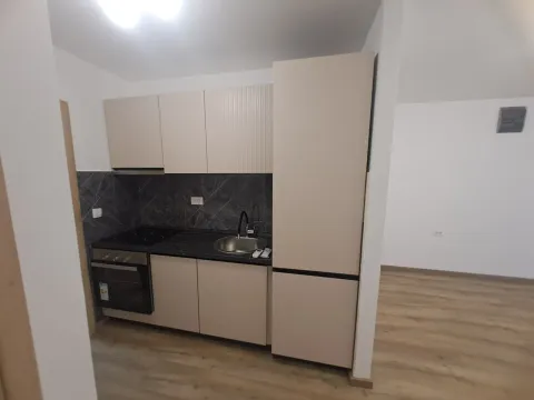 Small kitchen with built-in units and appliances. - image 5
