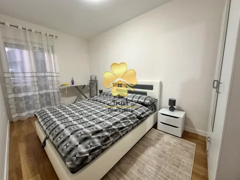 Furnished bedroom with a double bed, wardrobe, and nightstand. - image 7