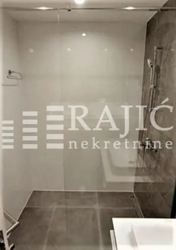 Modern bathroom with walk-in shower.