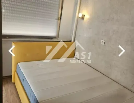 Bedroom with a double bed and a yellow headboard. - image 6