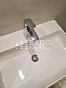 Modern washbasin with a faucet in the bathroom. - image 9