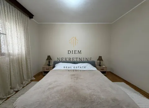 Furnished bedroom with a double bed and nightstands. - image 15