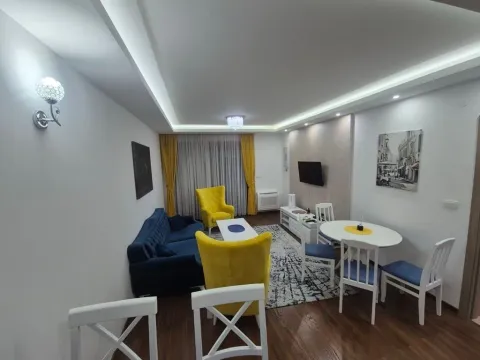 Spacious living room with a dining area and modern furniture. - image 4