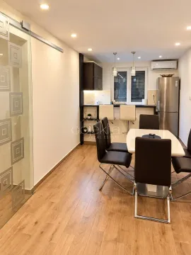 Small kitchen with a dining table and chairs. - image 3
