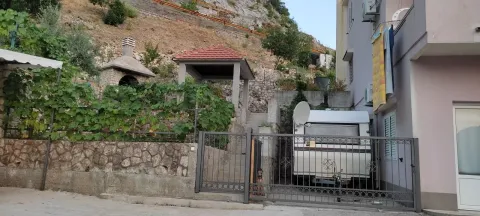 House yard with a gate, canopy, and built-in barbecue grill. - image 5