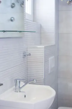 Modern bathroom with a sink and a mirror. - image 8