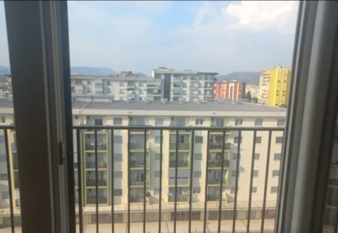 View from the apartment overlooking surrounding residential buildings and the city neighborhood. - image 3