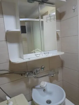 Small bathroom with a sink and mirror cabinet. - image 11