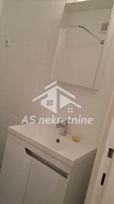 Bathroom with a sink and a mirror.
