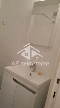 Bathroom with a sink and a mirror. - image 14
