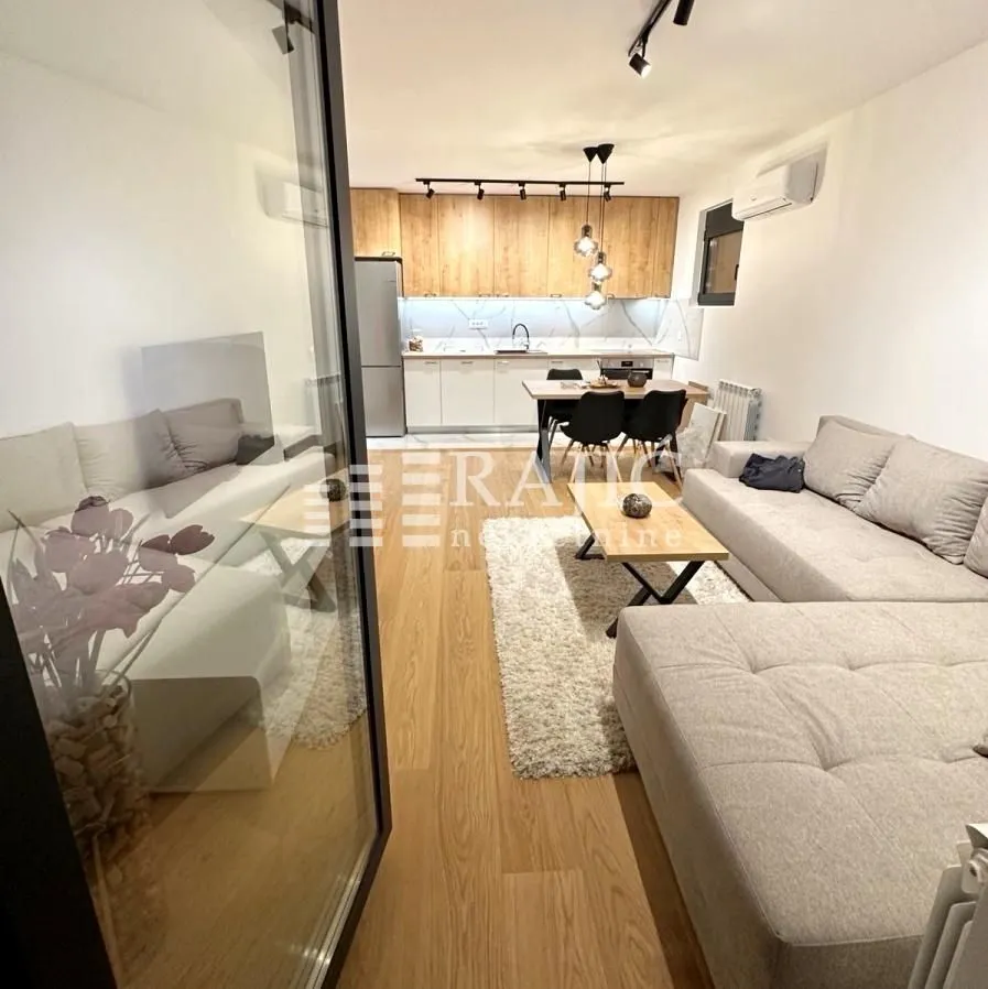 Living room connected to the dining area and kitchen.