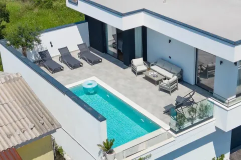 Terrace with a swimming pool and sun loungers on the roof of a modern house. - image 3
