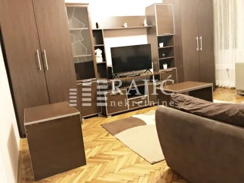 Living room with a sofa set, cabinet furniture, and a TV. - image 3