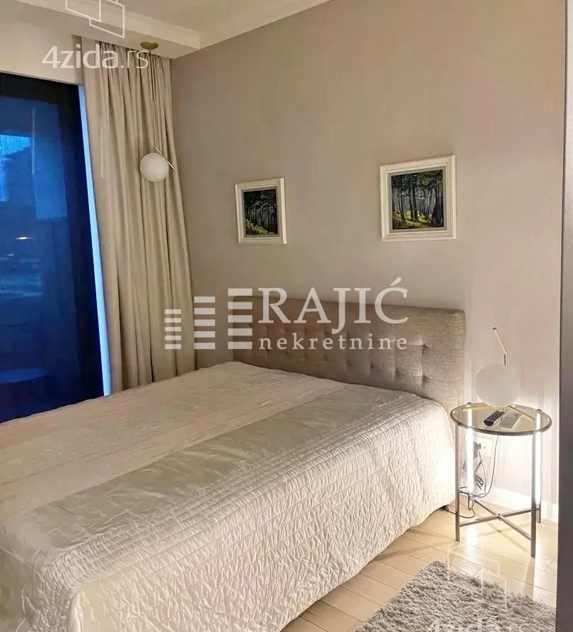 Furnished bedroom with a double bed.