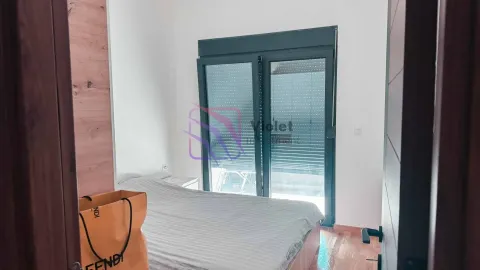 Smaller bedroom with a double bed and access to the terrace. - image 6