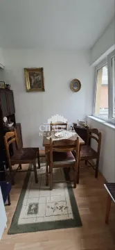 Dining table with chairs in the living room. - image 5