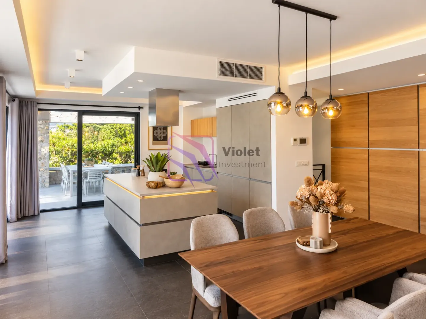 Modern kitchen with an island and dining area.