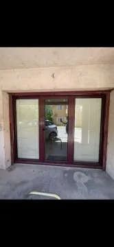 Entrance door with dark frame and blinds. - image 7