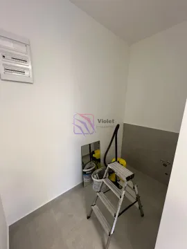 Small room during final works with a ladder and cleaning equipment. - image 8