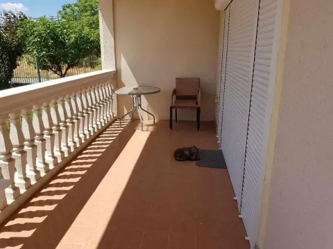 Terrace with a table and a chair. - image 6