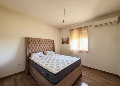 Bedroom with a double bed, window, and air conditioning unit. - image 10