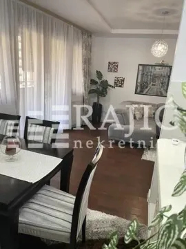 Living room with a dining area and seating set. - image 6