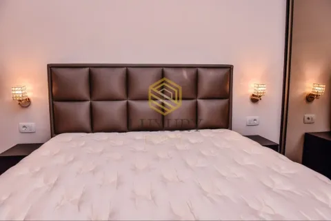 Modern bedroom with a double bed and upholstered headboard. - image 9