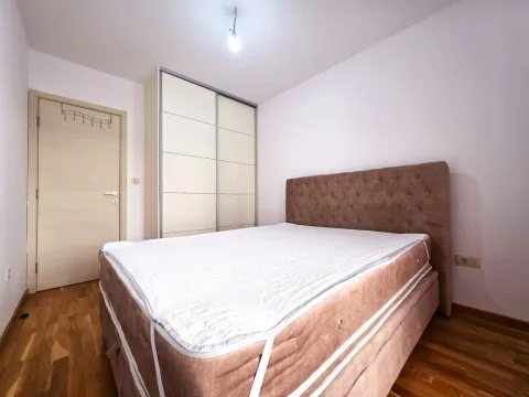 Bedroom with a double bed and a fitted wardrobe. - image 13