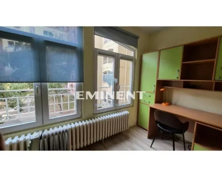 Children's room with a desk and a green wardrobe by the window. - image 10