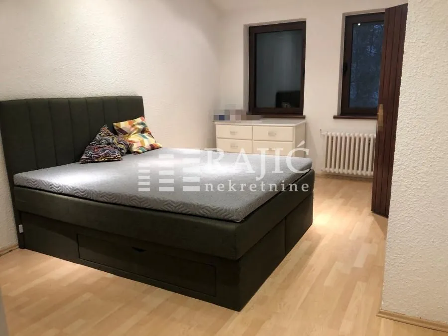 Furnished bedroom with a double bed.