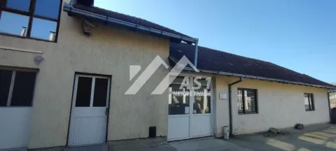 View of the exterior of a ground-floor building with entrance doors and windows. - image 6