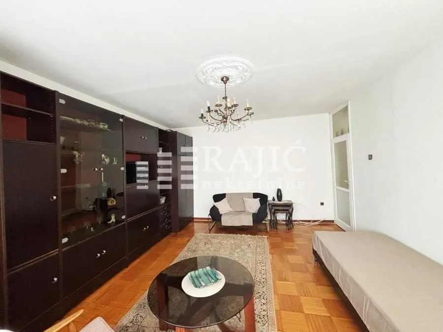 Living room with a sofa set and a large wardrobe.