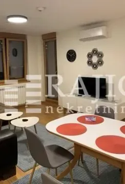 Living room with dining area and modern furniture. - image 3