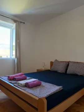 A bedroom featuring a double bed and a window. - image 8