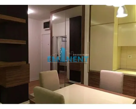 Dining area with a table and chairs connected to the kitchen. - image 7