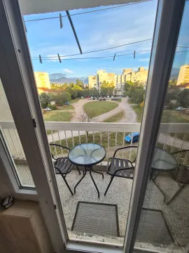 View from the terrace overlooking the neighborhood and surrounding greenery. - image 8