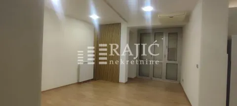 Empty room with hardwood floors and an agency watermark. - image 4