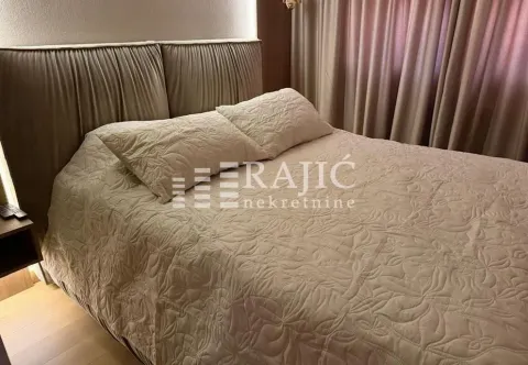 Furnished bedroom with a double bed. - image 11