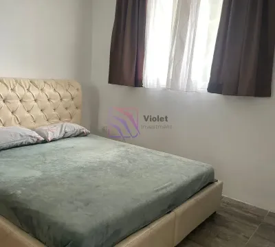 Bedroom with a double bed and a window with curtains. - image 12