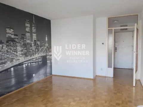 Empty living room with a city-themed wallpaper and parquet flooring. - image 4