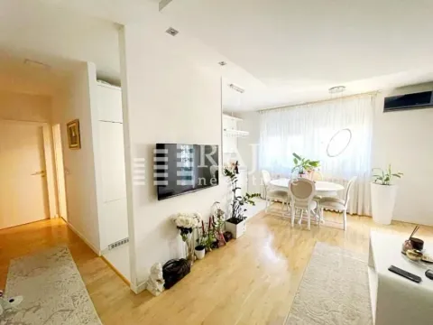 Spacious living room connected to the dining area with bright interior tones. - image 2